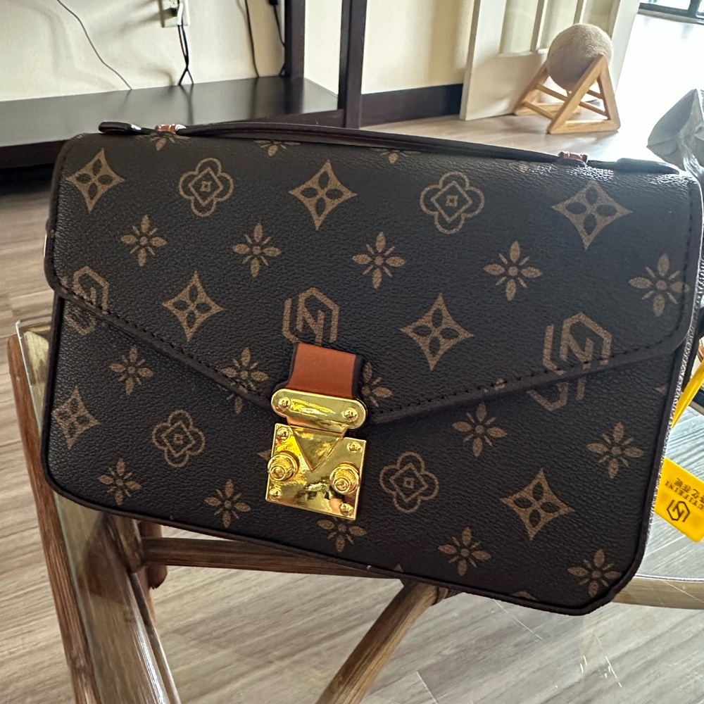 Elegant Monogram Crossbody Bag with Gold Clasp